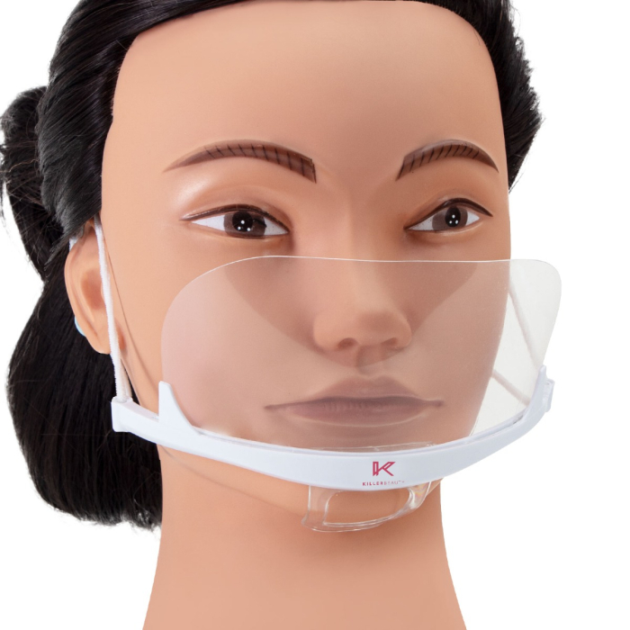La tête d'un mannequin présente un masque facial/buccal Killer Beauty du pack de 10 pièces, comprenant un écran transparent avec une armature blanche et des boucles d'oreilles, conçu pour laisser apparaître les expressions du visage.