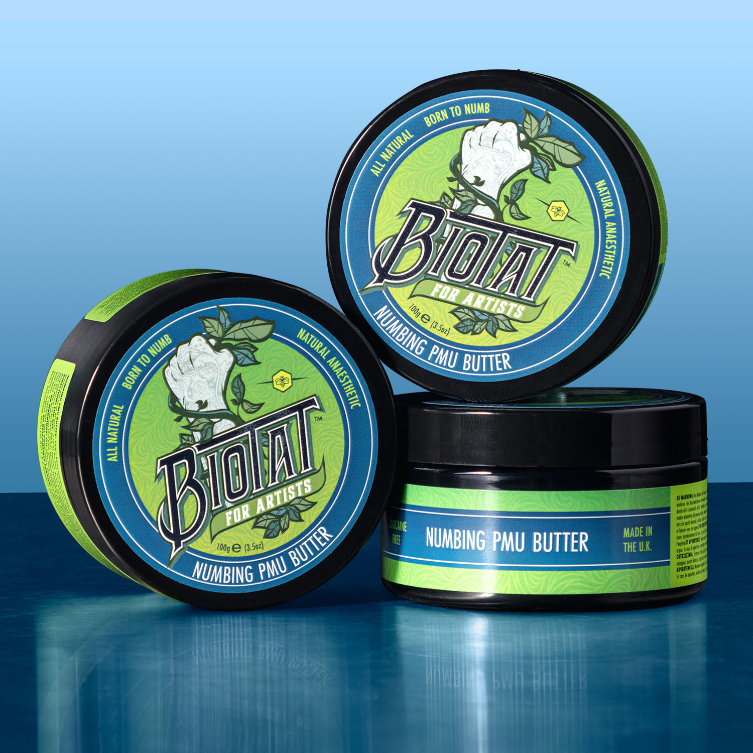 Tre barattoli di Biotat Numbing PMU Butter impilati uno sull'altro